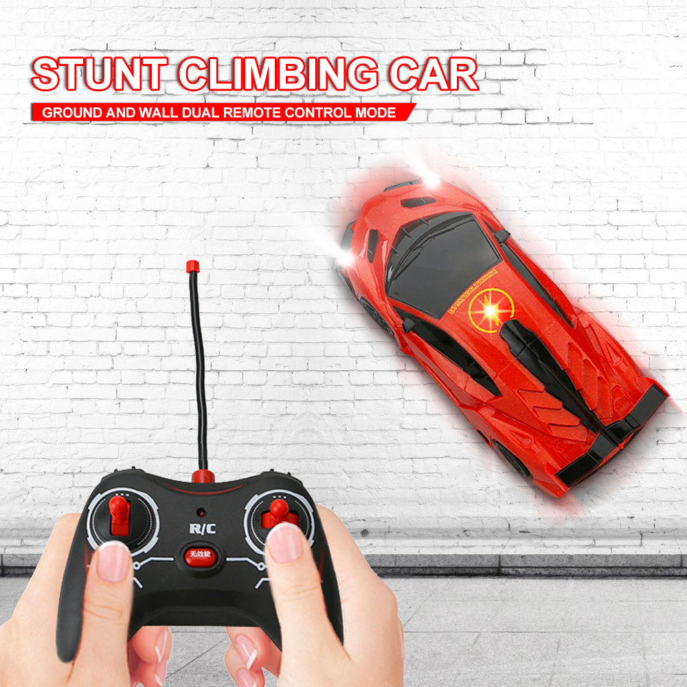 Remote Control Wall-Climbing Car - red car on a white brick wall with controller held in hands
