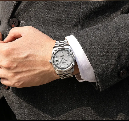 Men's Classic Watch - silver-tone watch worn on a wrist with a dark suit