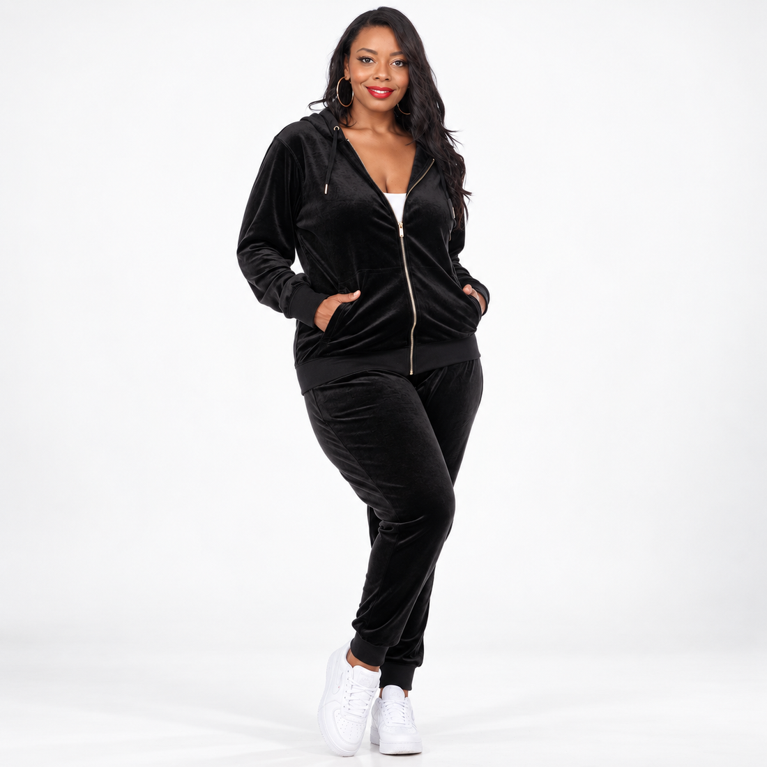 Women's Plus Size Velour Tracksuit Set - model wearing a black zip-up hoodie and matching pants