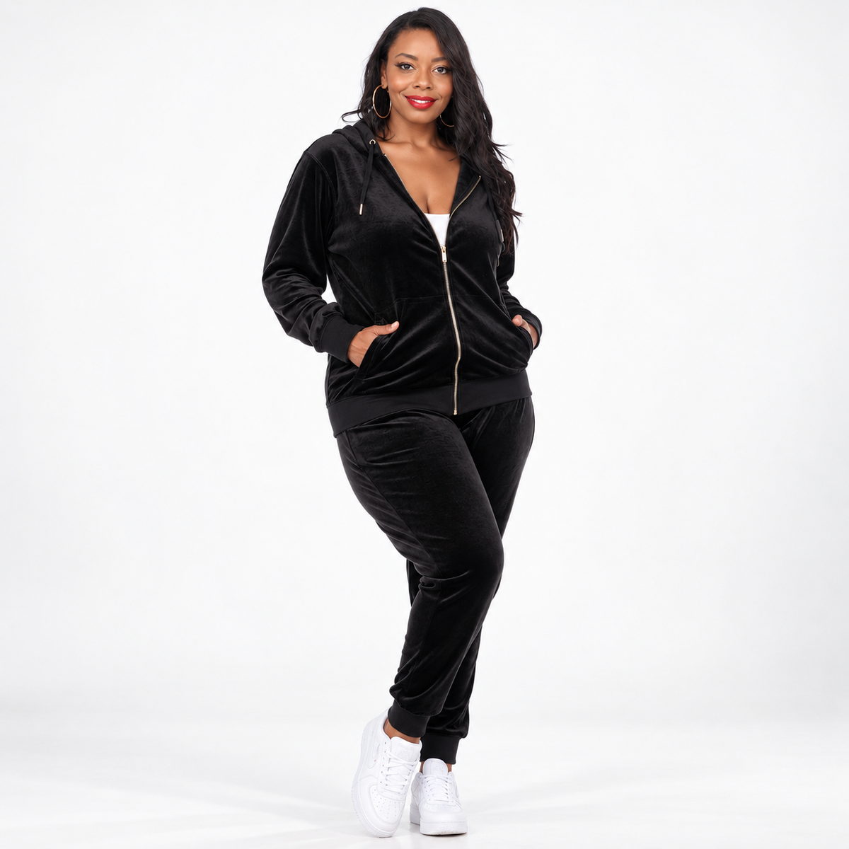 Women's Plus Size Velour Tracksuit Set - model wearing a black zip-up hoodie and matching pants