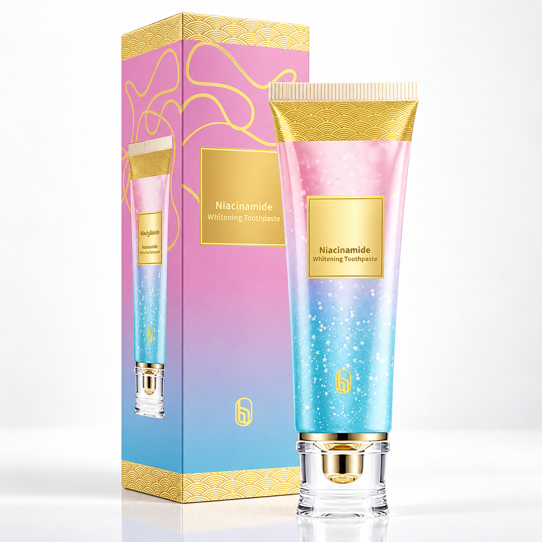 Nicotinamide Whitening Toothpaste - pink-and-blue tube with gold accents and matching box